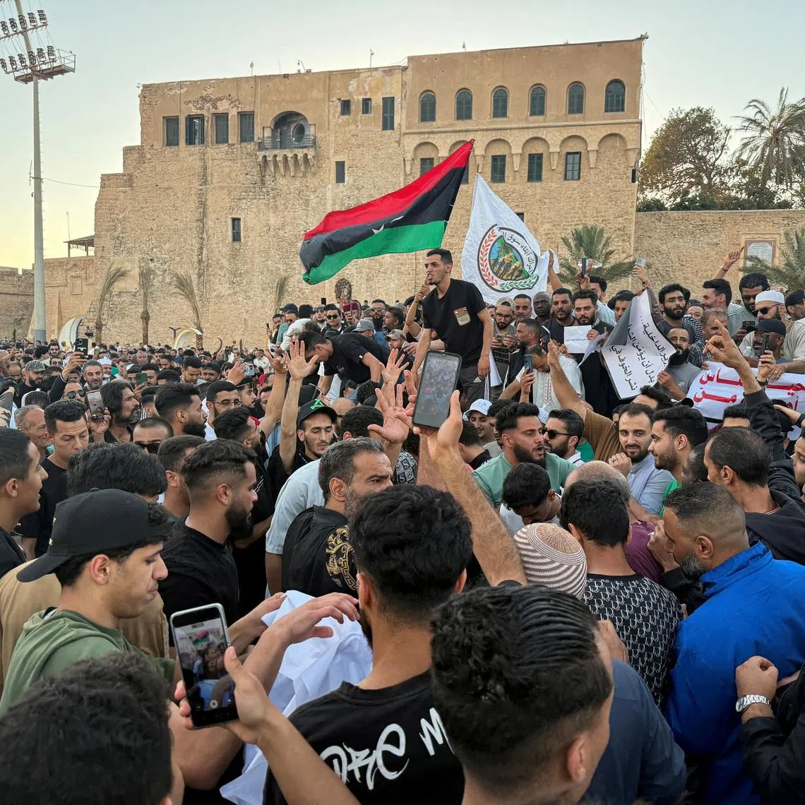 FILE PHOTO: Demonstrators demand the overthrow of the Libya's Government of National Unity headed by Abdulhamid al-Dbeibah, in Martyrs' Square in Tripoli, Libya. May 16, 2025.  REUTERS/Ayman al-Sahili/File Photo