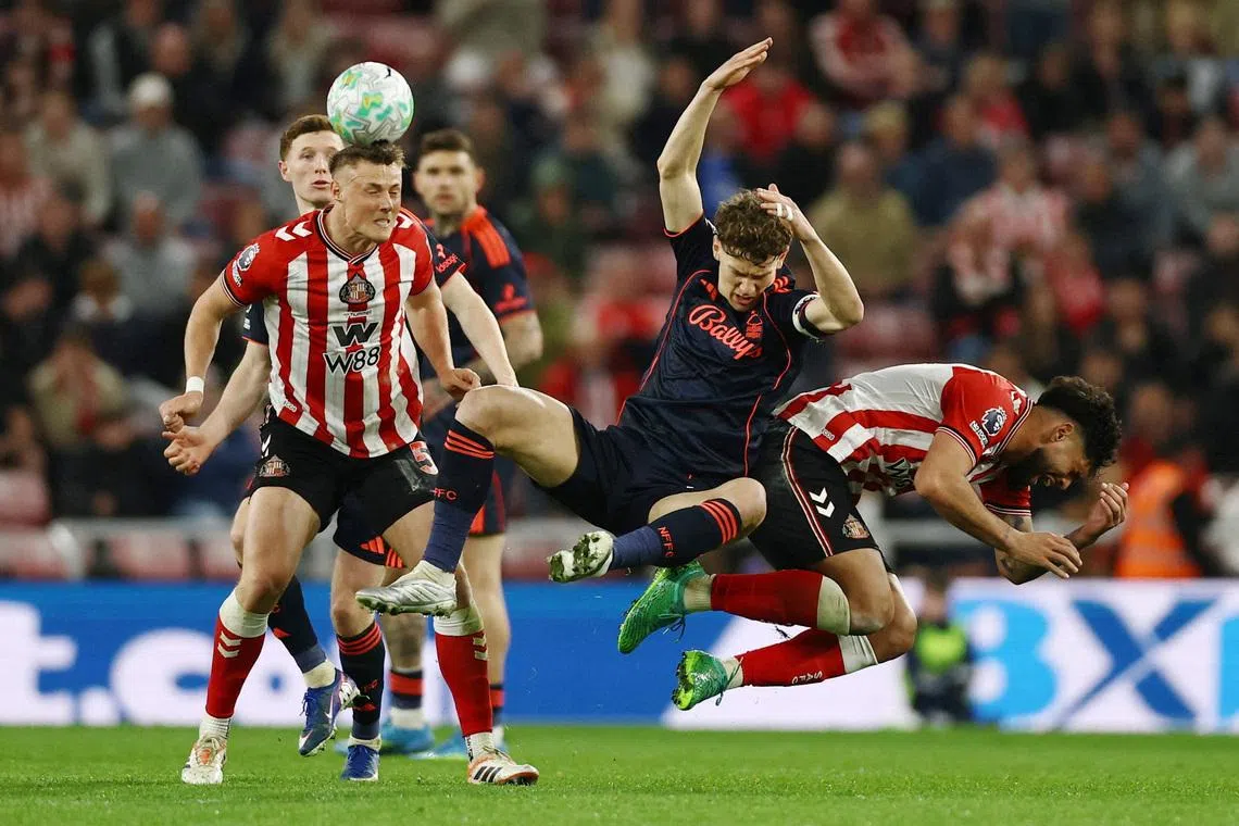 Soccer Football - Premier League - Sunderland v Nottingham Forest - Stadium of Light, Sunderland, Britain - April 24, 2026 Sunderland's Daniel Ballard and Sunderland's Omar Alderete in action with Nottingham Forest's Ryan Yates Action Images via Reuters/Lee Smith