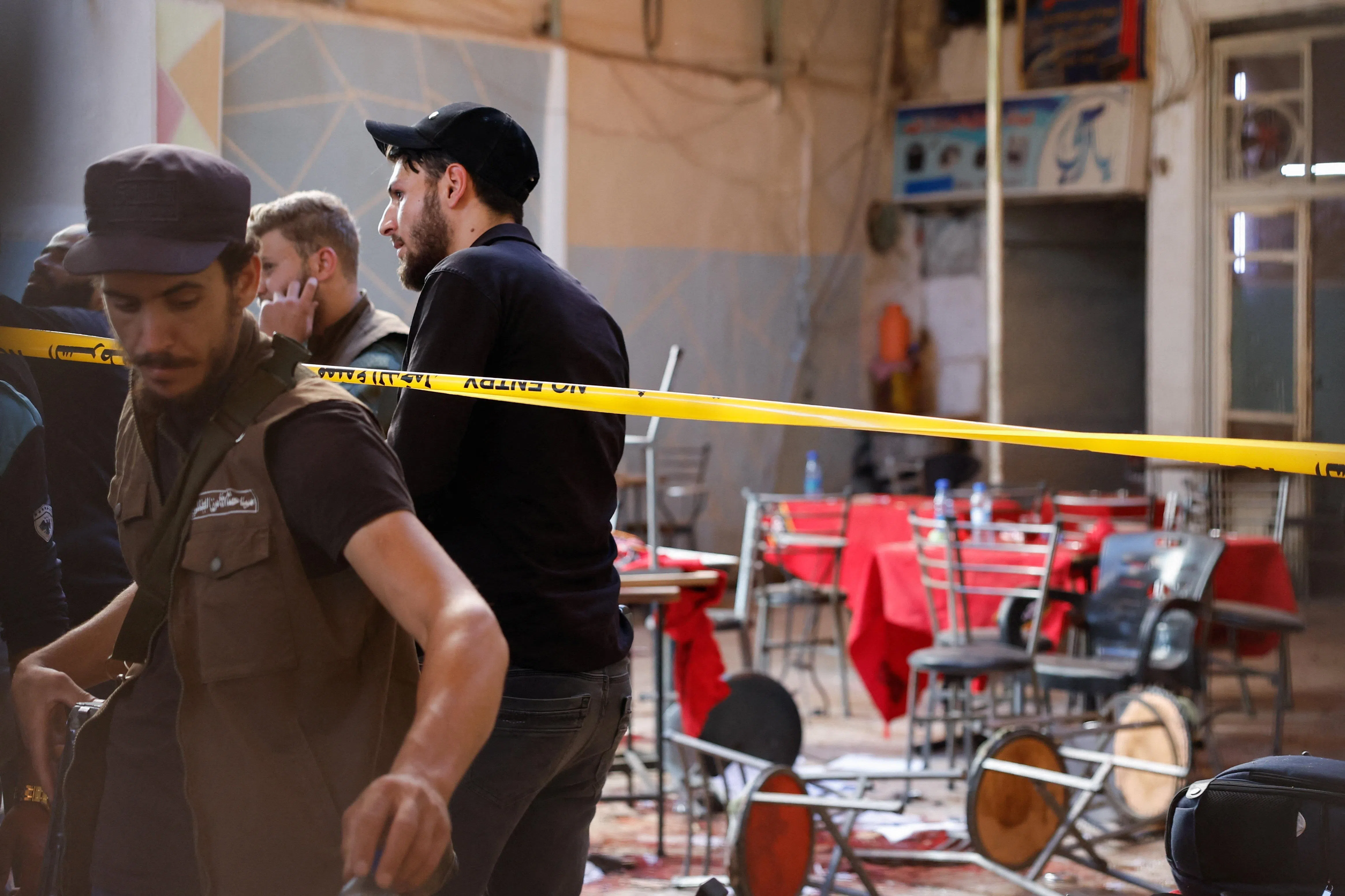 Members of emergency services work at the site of what Syrian state media reported was a blast at a cafe in central Damascus, Syria, July 2, 2026. REUTERS/Yamaam Al Shaar