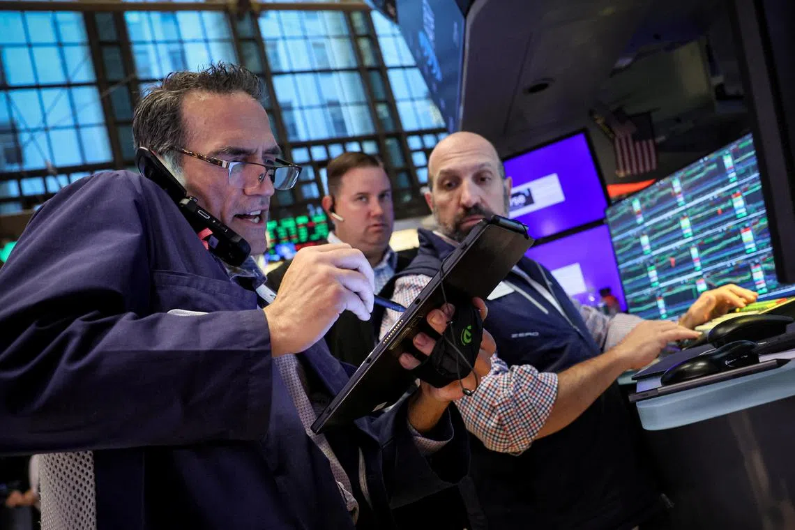 Traders working on the floor of the New York Stock Exchange, in New York City, on July 3.  