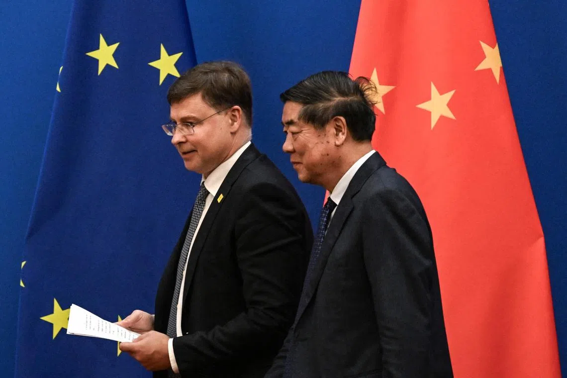 Executive Vice-President and European Commissioner for Trade Valdis Dombrovskis (L) and Chinese Vice-Premier He Lifeng leaving a media conference during the 10th China-EU high level economic and trade dialogue at the Diaoyutai State Guesthouse in Beijing on Sept 25, 2023.