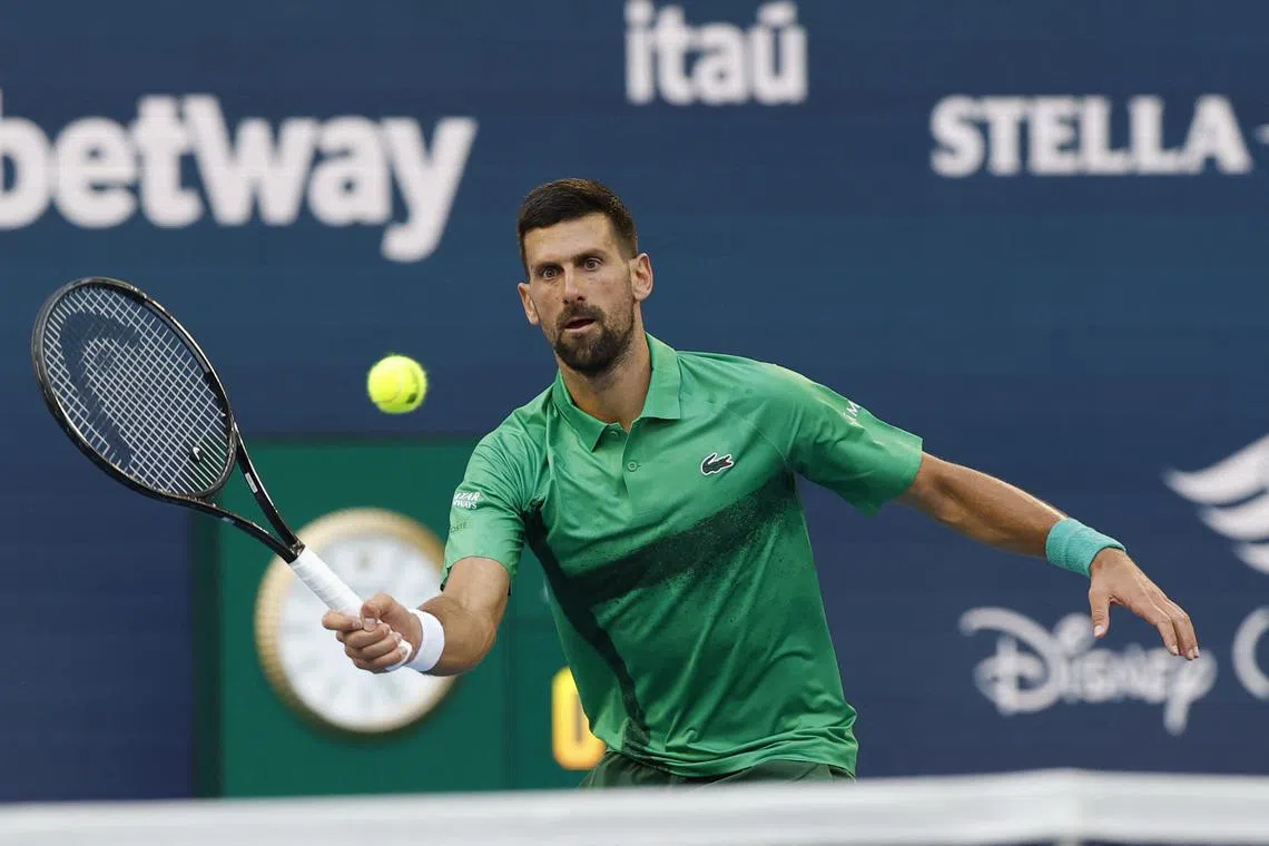 FILE PHOTO: Mar 27, 2025; Miami, FL, USA; Novak Djokovic (SRB) hits a volley against Sebastian Korda (USA)(not pictured) in a men's singles quarterfinal on day ten of the Miami Open at Hard Rock Stadium. Mandatory Credit: Geoff Burke-Imagn Images/File Photo