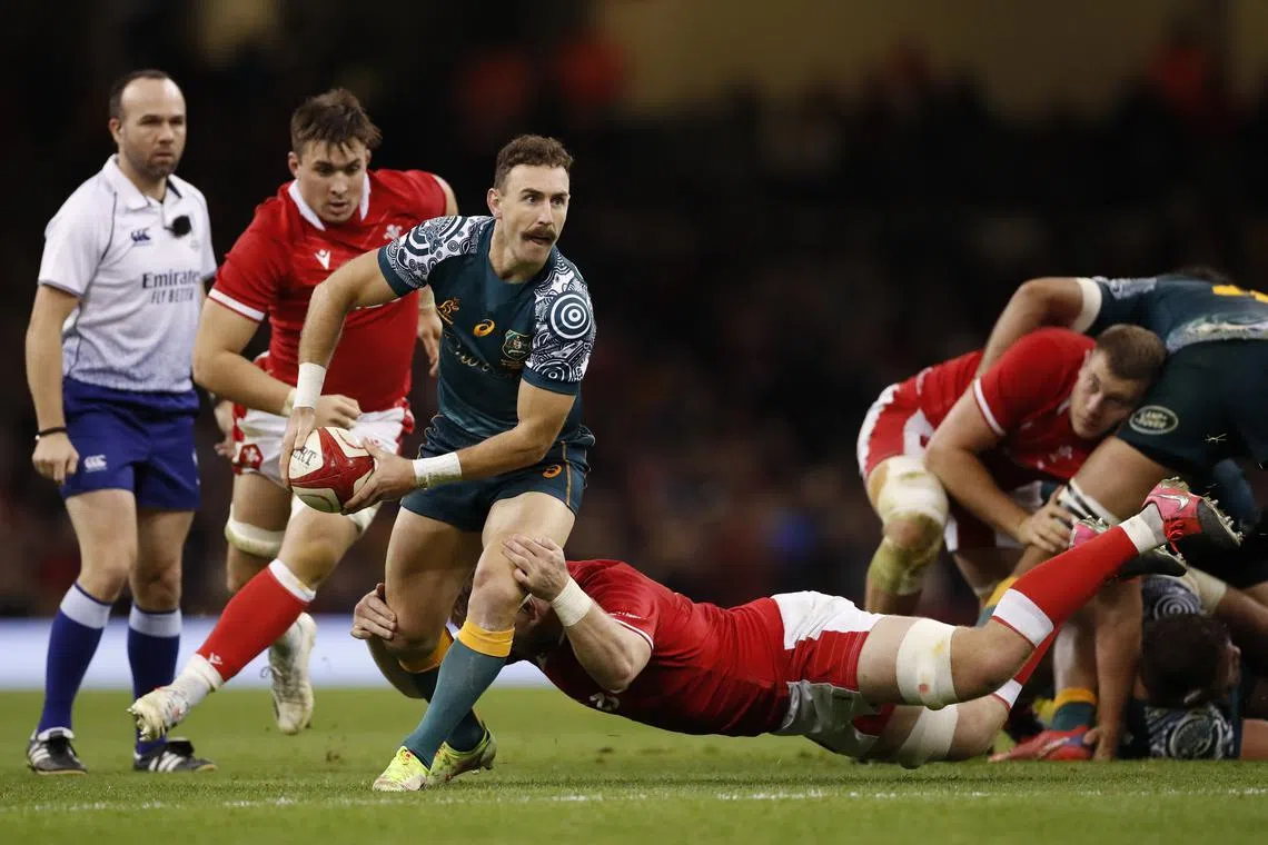FILE PHOTO: Rugby Union - Autumn International - Wales v Australia - Principality Stadium, Cardiff, Wales, Britain - November 20, 2021 Australia's Nic White in action with Wales' Aaron Wainwright Action Images via Reuters/Andrew Boyers/File Photo