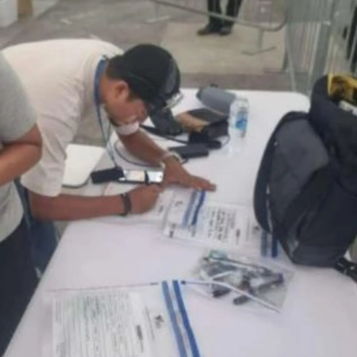 Health Sciences Authority officers conducting an operation at ZoukOut 2023, where some 176 people were caught using e-vaporisers.