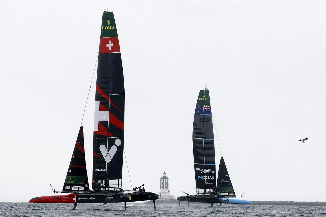 The Switzerland and New Zealand boats sail during practice racing ahead of the Rolex Los Angeles Sail Grand Prix on March 14, 2025 in California.