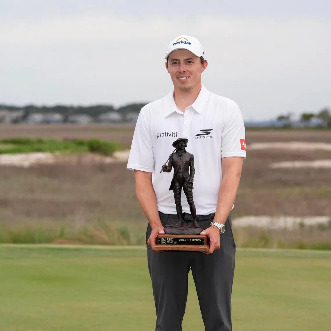 Matt Fitzpatrick celebrates his playoff win and receives his trophy after the overtime win  of the RBC Heritage.