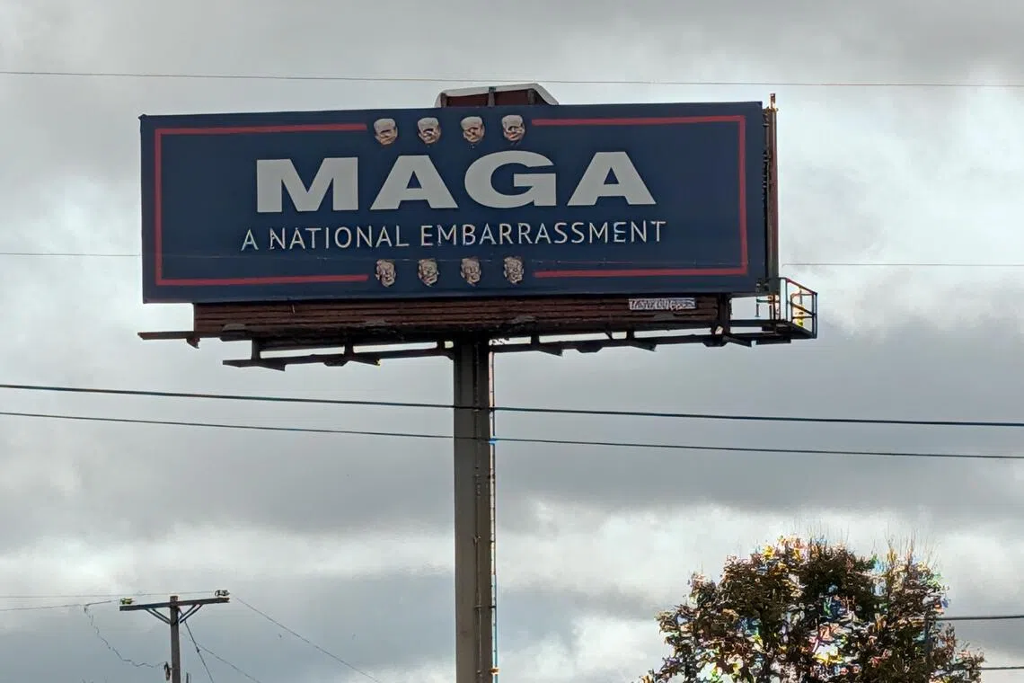 A large board with the message “MAGA: a national embarrassment” towers over the Pennsylvania Turnpike in Bedford county. The largely rural area is overwhelmingly Republican, it voted for Donald Trump by thumping margins in the last three presidential elections.