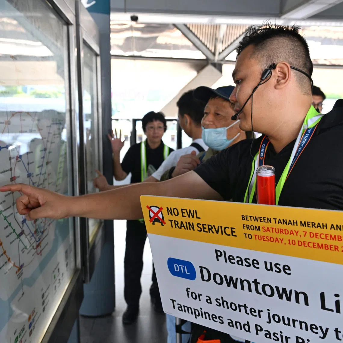 ST PHOTO: Chong Jun Liang

Generic photo of staff giving directions to commuters at Expo MRT station on Dec 7, 2024.