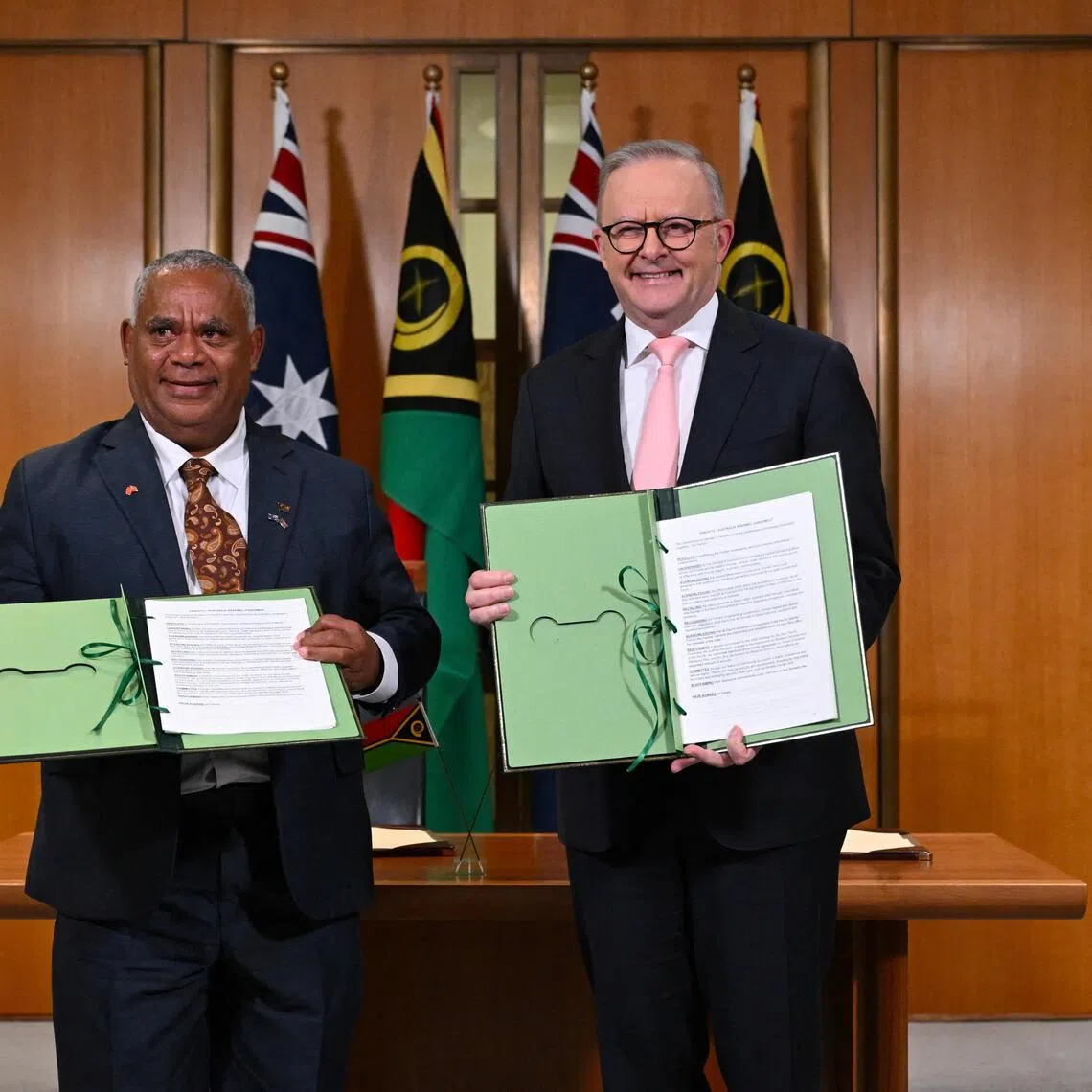 Vanuatu Prime Minister Jotham Napat (left) and Australian Prime Minister Anthony Albanese after signing the Nakamal agreement at Parliament House in Canberra, Australia, on June 29.