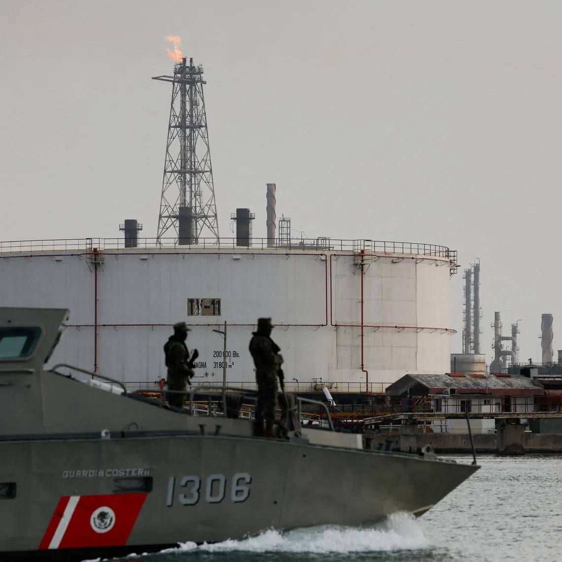 FILE PHOTO: A Mexican Navy boat patrols the perimeter of the Francisco I. Madero refinery of state oil company Pemex in Ciudad Madero, Mexico, May 28, 2025. REUTERS/Daniel Becerril/File Photo