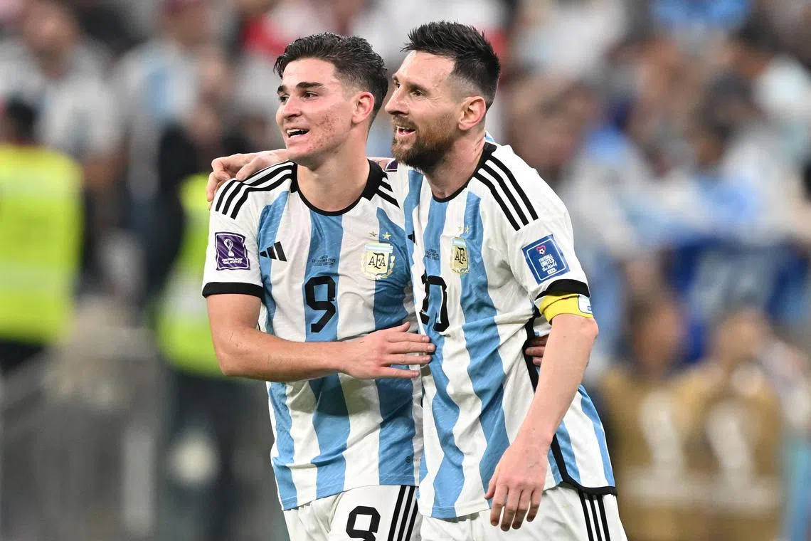 Julian Alvarez (left) celebrates with teammate Lionel Messi after scoring during the World Cup 2022 semi-final against Croatia.
