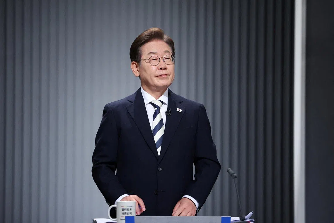 FILE PHOTO: Lee Jae-myung, the presidential candidate for South Korea's Democratic Party, prepares for the second televised debate for the upcoming presidential election in Seoul, South Korea, May 23, 2025.     REUTERS/Kim Hong-Ji/Pool/File Photo