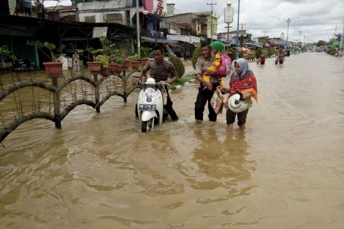 Indonesia’s Riau ready to evacuate residents from flooding areas after fighting forest fires
