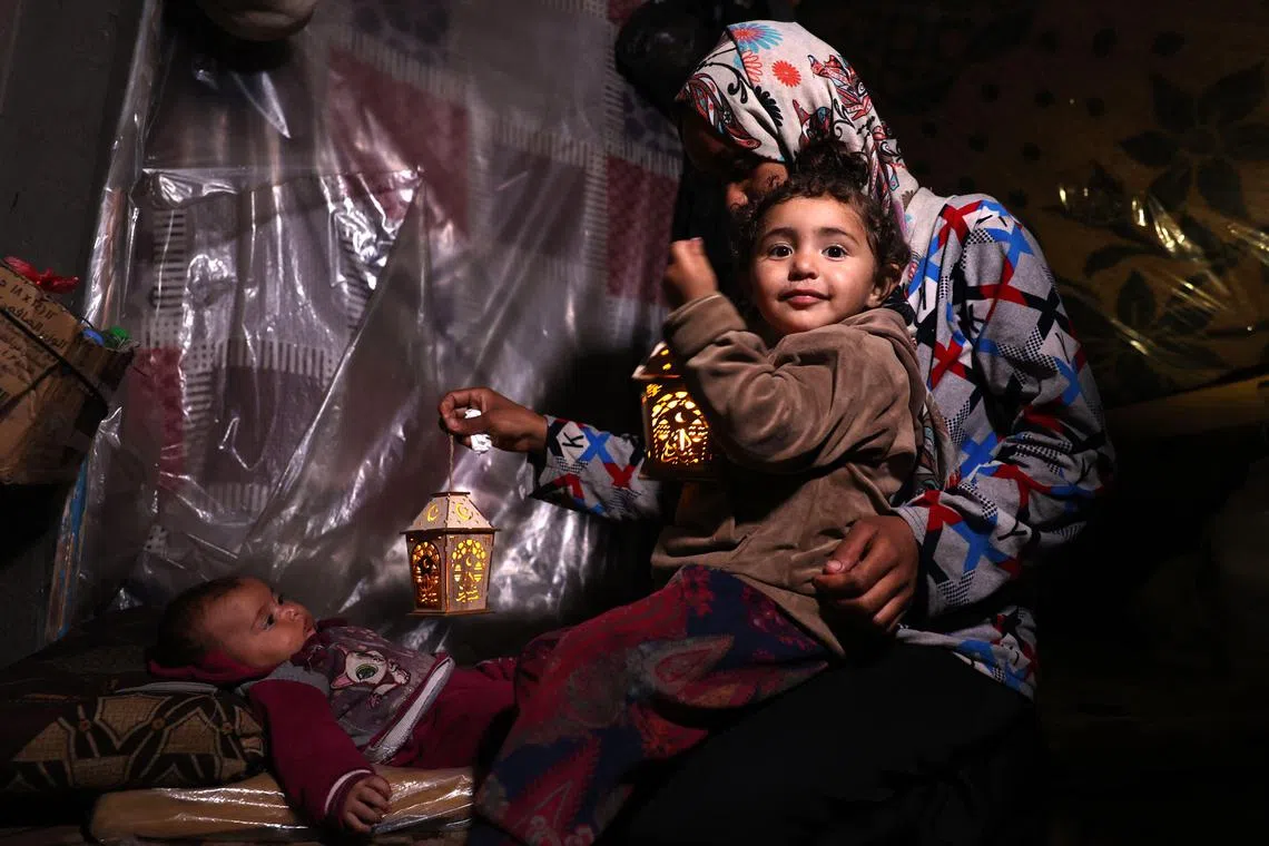 Across Gaza this year, the lights are among the few signs signalling the coming holy month, amid dire warnings of mass starvation.
