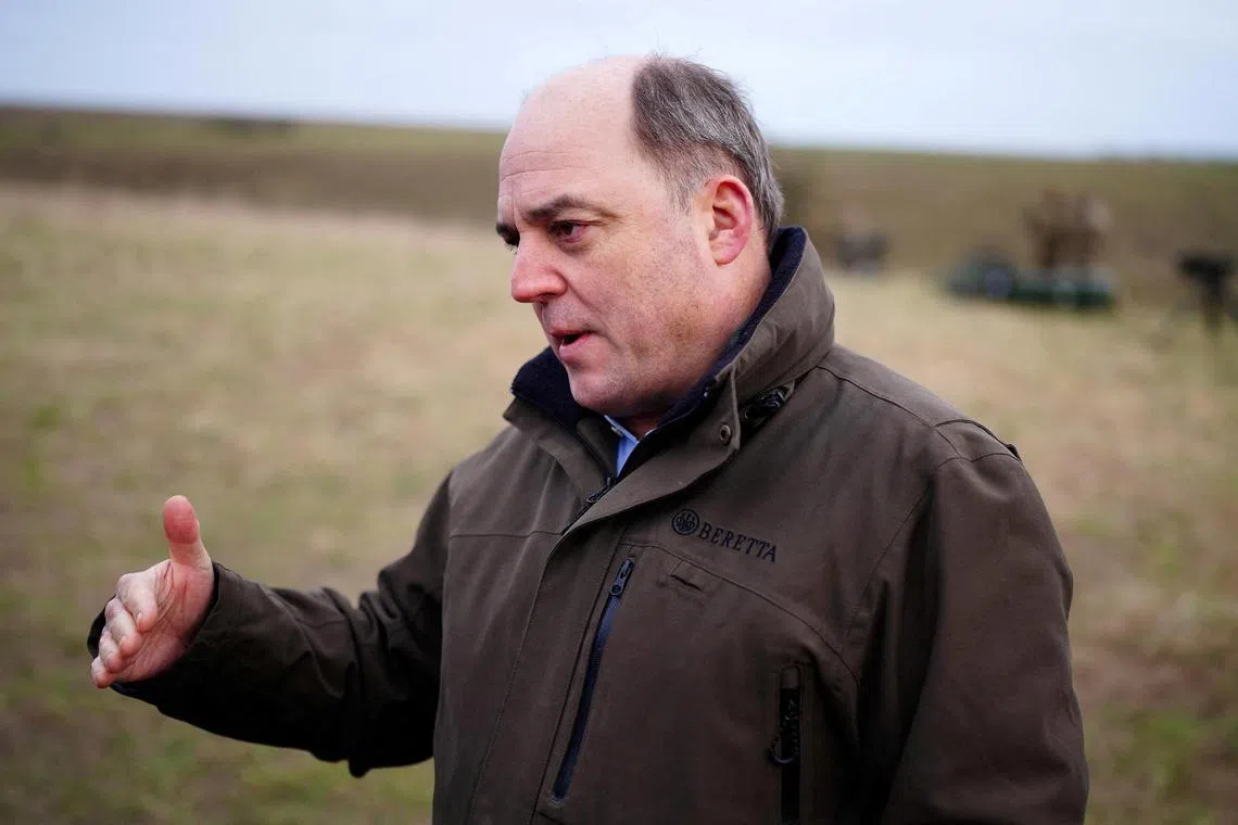 British Defence Secretary Ben Wallace speaks to the media during a visit to watch Australian Defence Forces helping to train Ukrainian recruits in Britain.