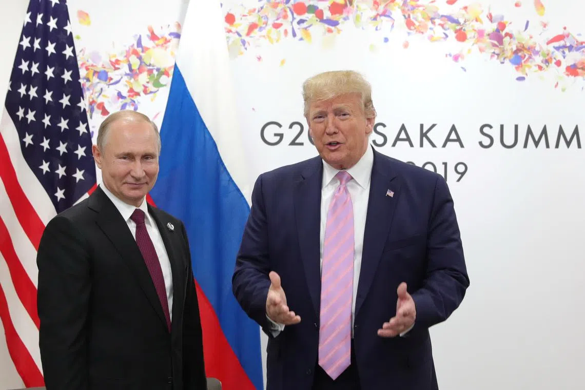 FILE PHOTO: Russia's President Vladimir Putin and U.S. President Donald Trump attend a meeting on the sidelines of the G20 summit in Osaka, Japan June 28, 2019. Sputnik/Mikhail Klimentyev/Kremlin via REUTERS/File Photo