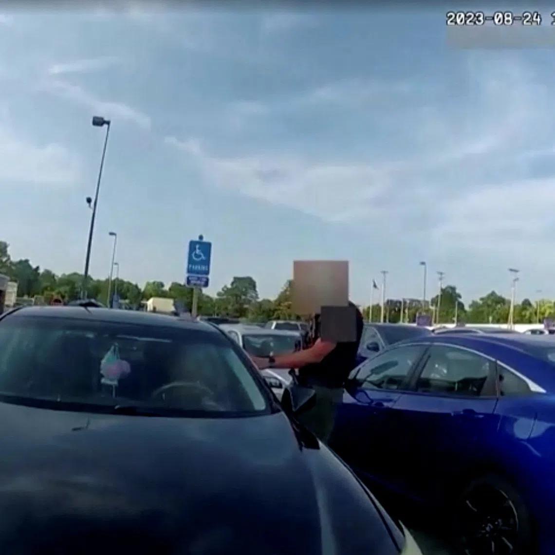 Screen capture obtained from a body camera footage showing an officer fatally shooting a pregnant Black woman in the parking lot of a grocery store in Blendon Township, Ohio on August 24, 2023, after she refused to exit her car and instead bumped him with her vehicle.