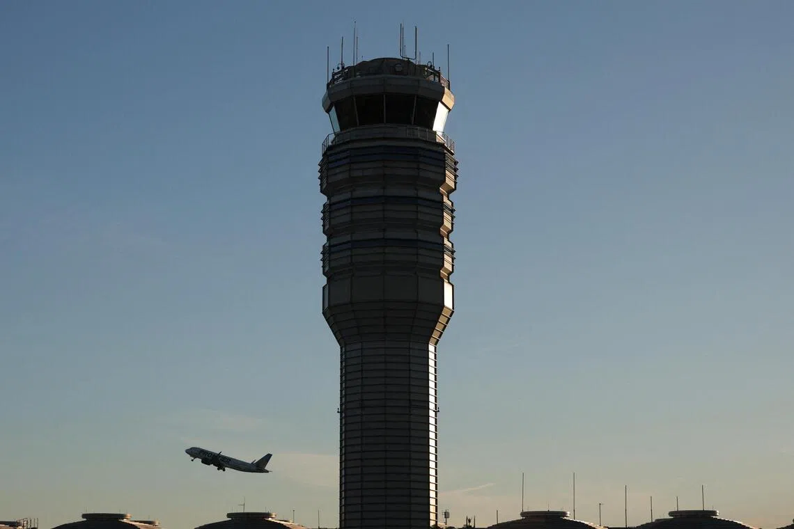 The control tower stands at Ronald Reagan Washington National Airport as a plane takes off on Oct 27, 2025 in Arlington, Virginia.