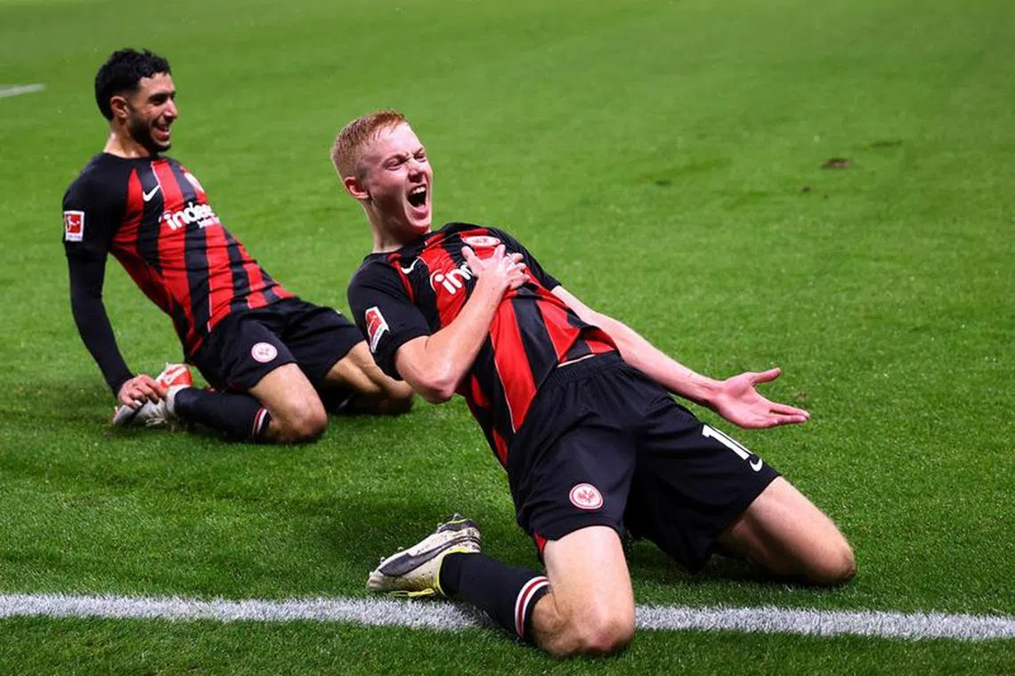 Soccer Football - Bundesliga - Eintracht Frankfurt v Bayern Munich - Deutsche Bank Park, Frankfurt, Germany - December 9, 2023 Eintracht Frankfurt's Hugo Larsson celebrates after scoring their third goal REUTERS/Kai Pfaffenbach
