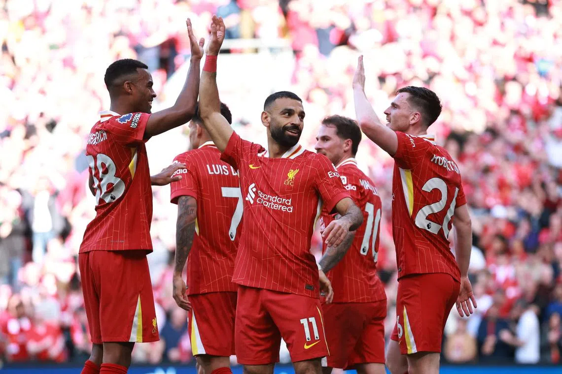 Soccer Football - Premier League - Liverpool v Tottenham Hotspur - Anfield, Liverpool, Britain - April 27, 2025 Liverpool's Mohamed Salah celebrates scoring their fourth goal with teammates REUTERS/Phil Noble