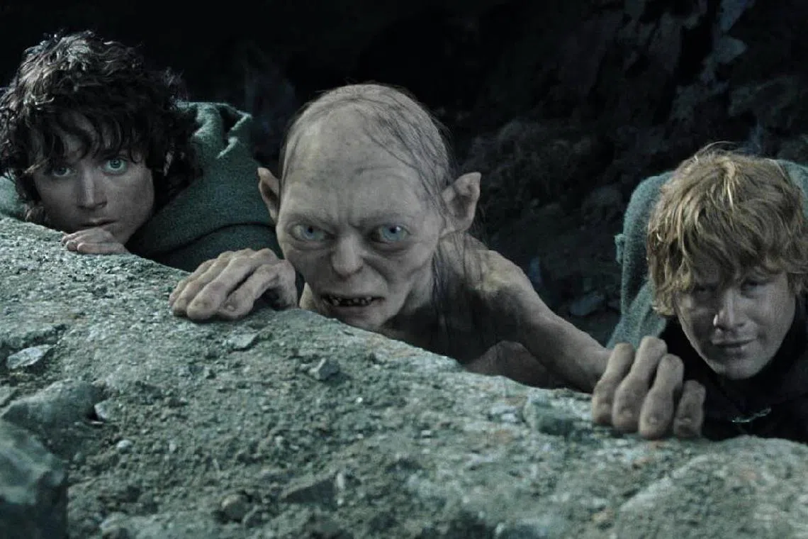 A cinema still from The Lord Of The Rings: The Return Of The King, featuring the characters Frodo (Elijah Wood), Gollum (Andy Serkis) and Sam (Sean Astin).