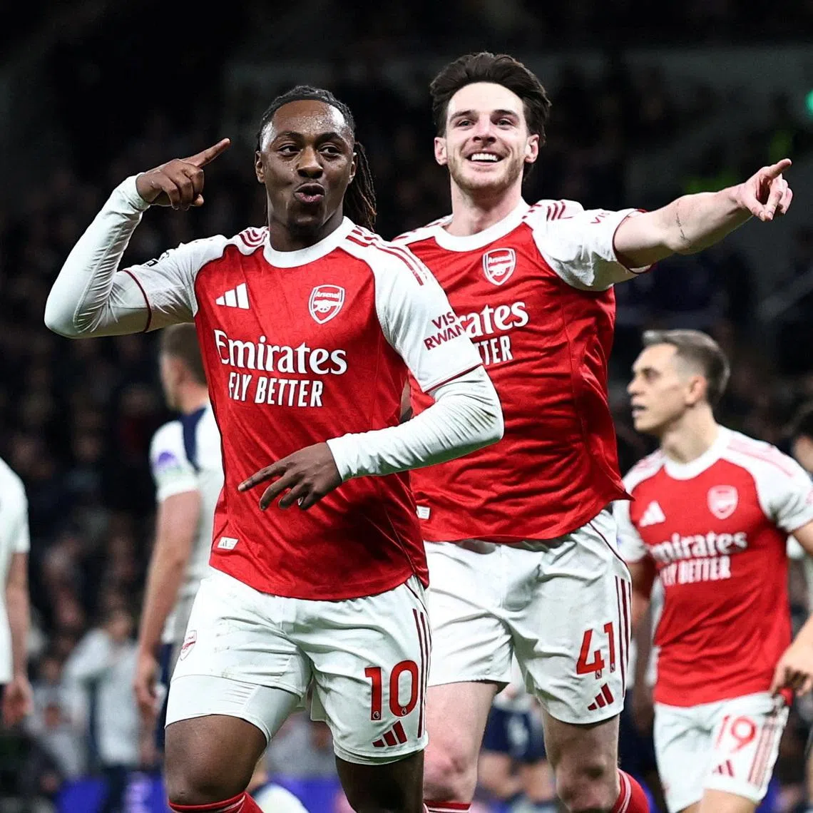 Soccer Football - Premier League - Tottenham Hotspur v Arsenal - Tottenham Hotspur Stadium, London, Britain - February 22, 2026 Arsenal's Eberechi Eze celebrates scoring their third goal with Declan Rice REUTERS/David Klein