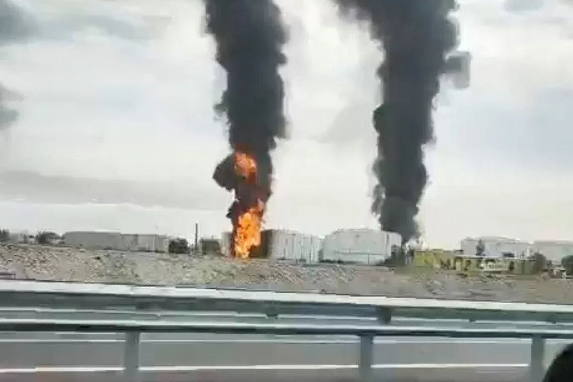 A fire at an oil depot in Feodosia, Crimea, on the day the Ukrainian military said the energy facility was targeted on Oct 7.