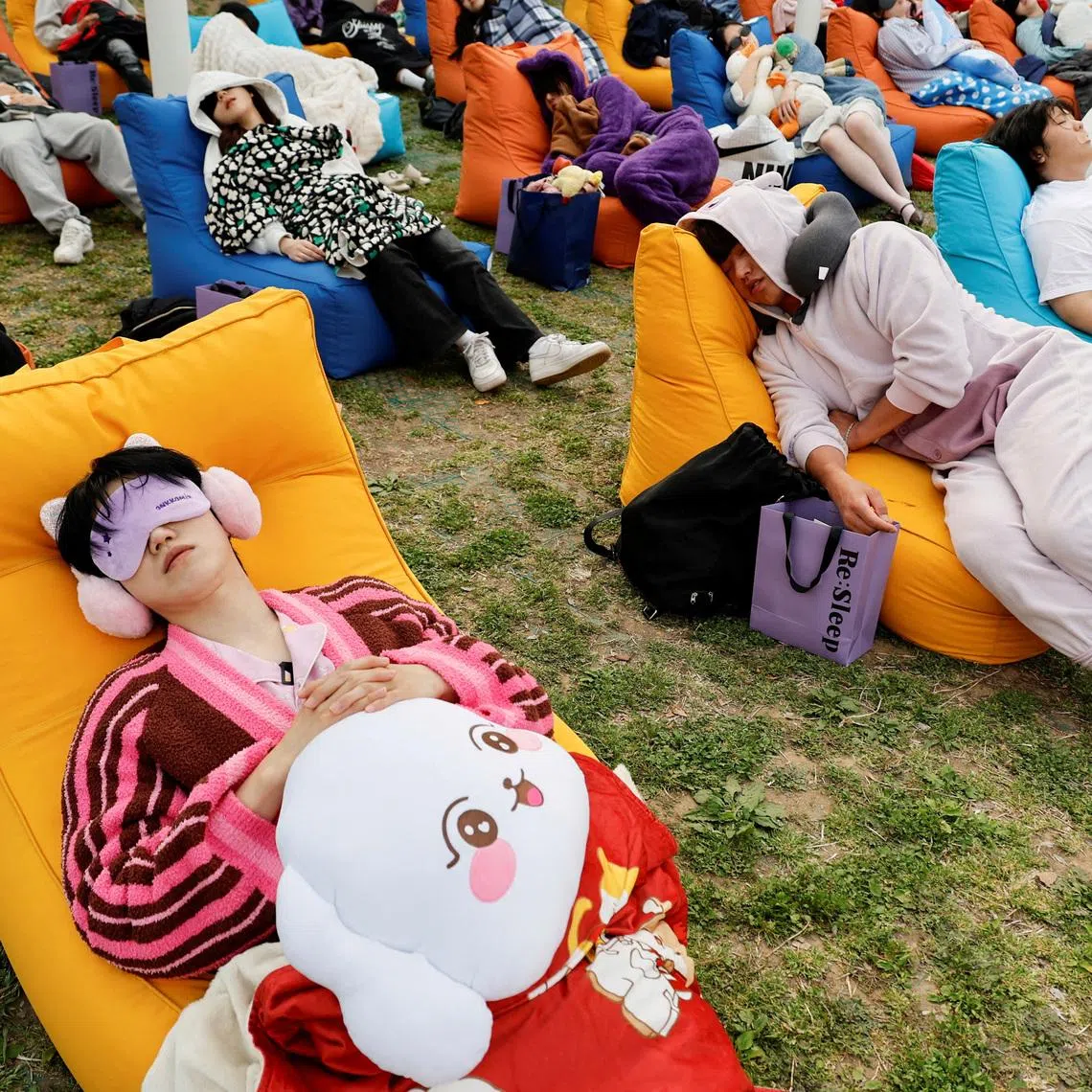Participants sleep during the 2026 Power Nap contest at Han River park in Seoul on May 2.