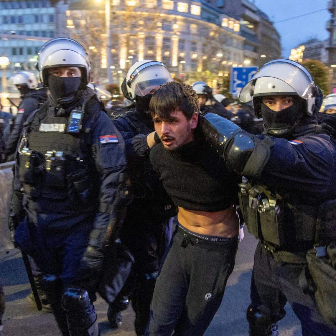 Police officers detain a demonstrator as people rally to protest police search of Belgrade's university offices after the accidental death of a student last week, in Belgrade, Serbia, March 31, 2026. REUTERS/Djordje Kojadinovic