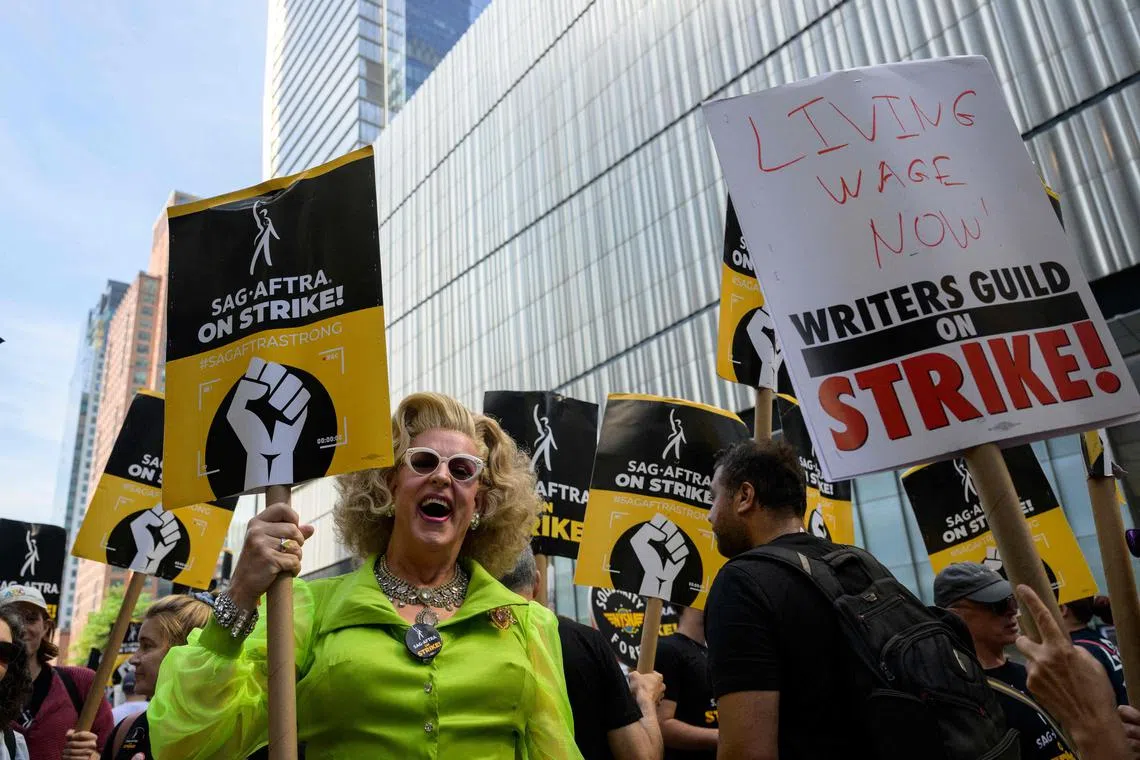 Actors, writers and other union members join SAG-AFTRA and WGA strikers on a picket line  in front of the offices of HBO and Amazon, during the National Union Solidarity Day in New York City on August 22, 2023. Professional hairdressers and makeup artists work in the shadows of celebrities to make them sparkle on sets, red carpets and magazine covers. But from New York to Los Angeles, the historic strike of American screenwriters and actors is leaving the workers responsible for making up the stars with blank appointment books and empty savings accounts. 