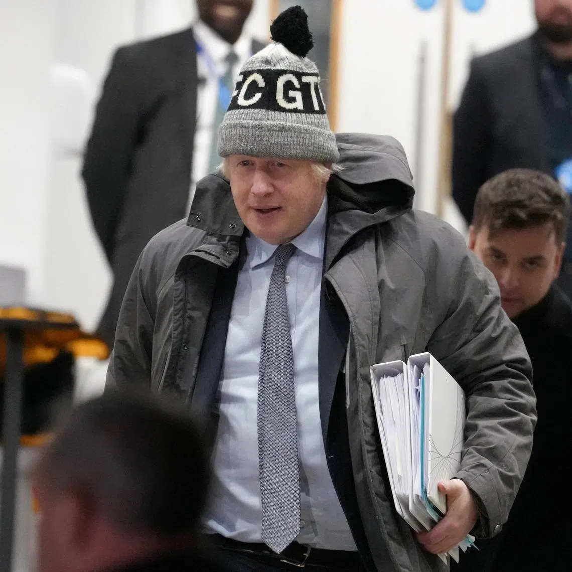 FILE PHOTO: Former British Prime Minister Boris Johnson walks outside the Dorland House on the day he gives evidence at the UK COVID-19 Inquiry, in London, Britain, December 6, 2023. REUTERS/Maja Smiejkowska/File Photo