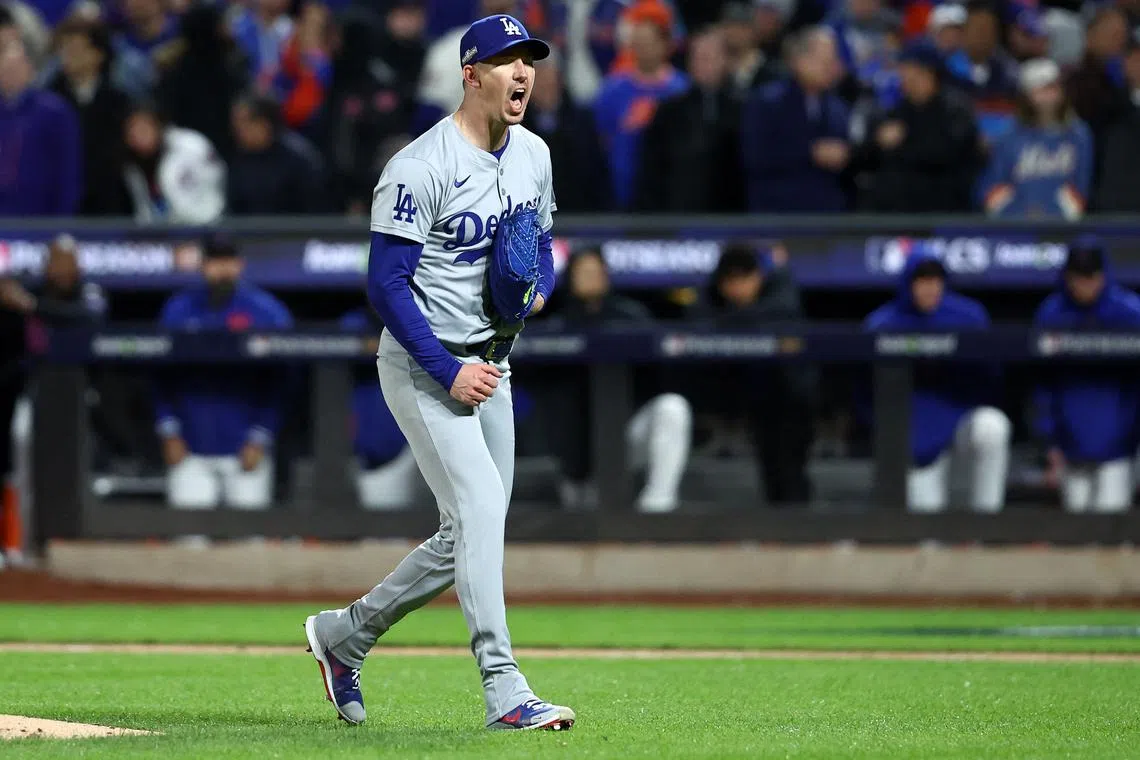 FILE PHOTO: Oct 16, 2024; New York City, New York, USA; Los Angeles Dodgers pitcher Walker Buehler (21) reacts after an out against the New York Mets in the second inning during game three of the NLCS for the 2024 MLB playoffs at Citi Field. Mandatory Credit: Wendell Cruz-Imagn Images/File Photo