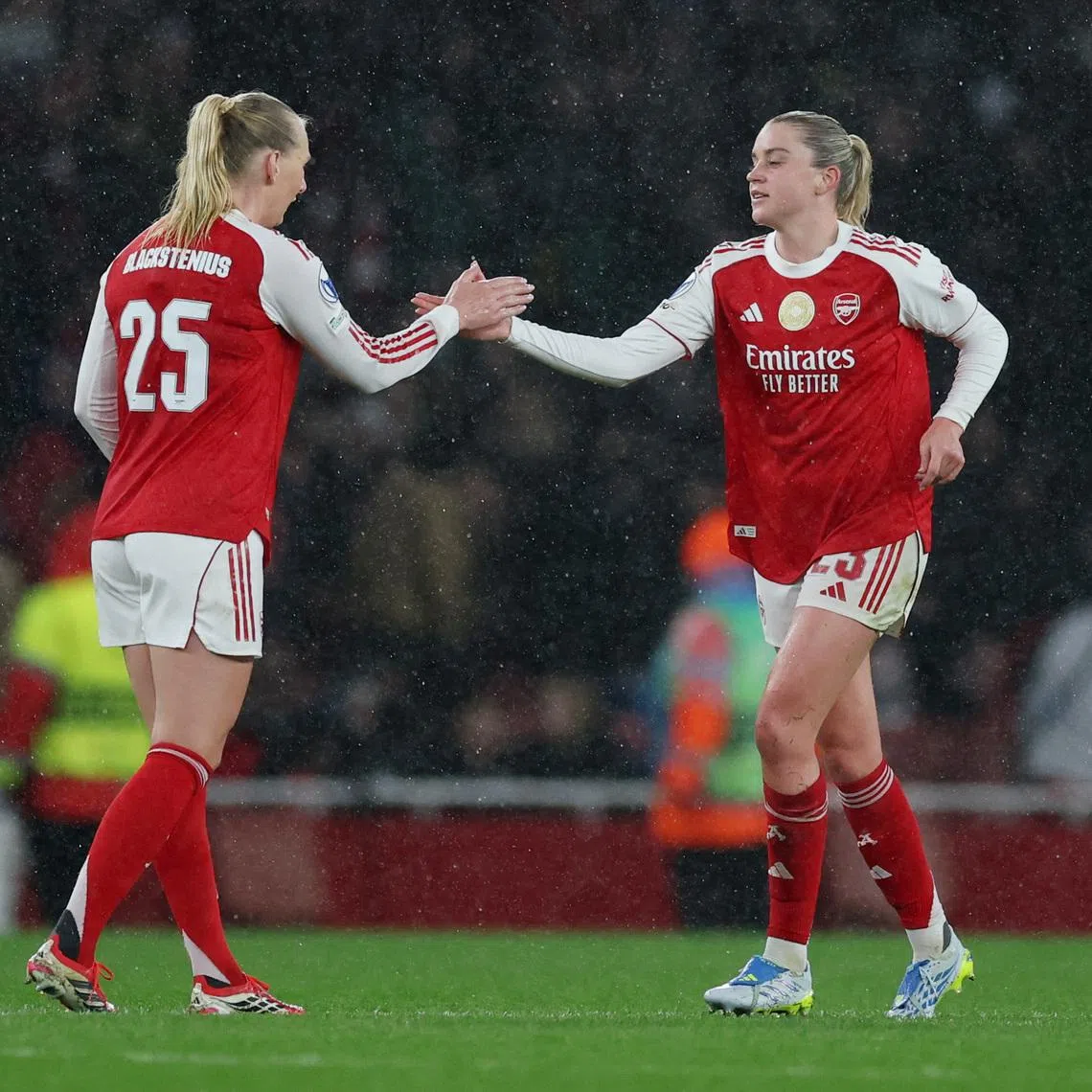 Soccer Football - UEFA Women's Champions League - Quarter Finals - First Leg - Arsenal v Chelsea - Emirates Stadium, London, Britain - March 24, 2026 Arsenal's Alessia Russo celebrates scoring their third goal with Stina Blackstenius Action Images via Reuters/Paul Childs