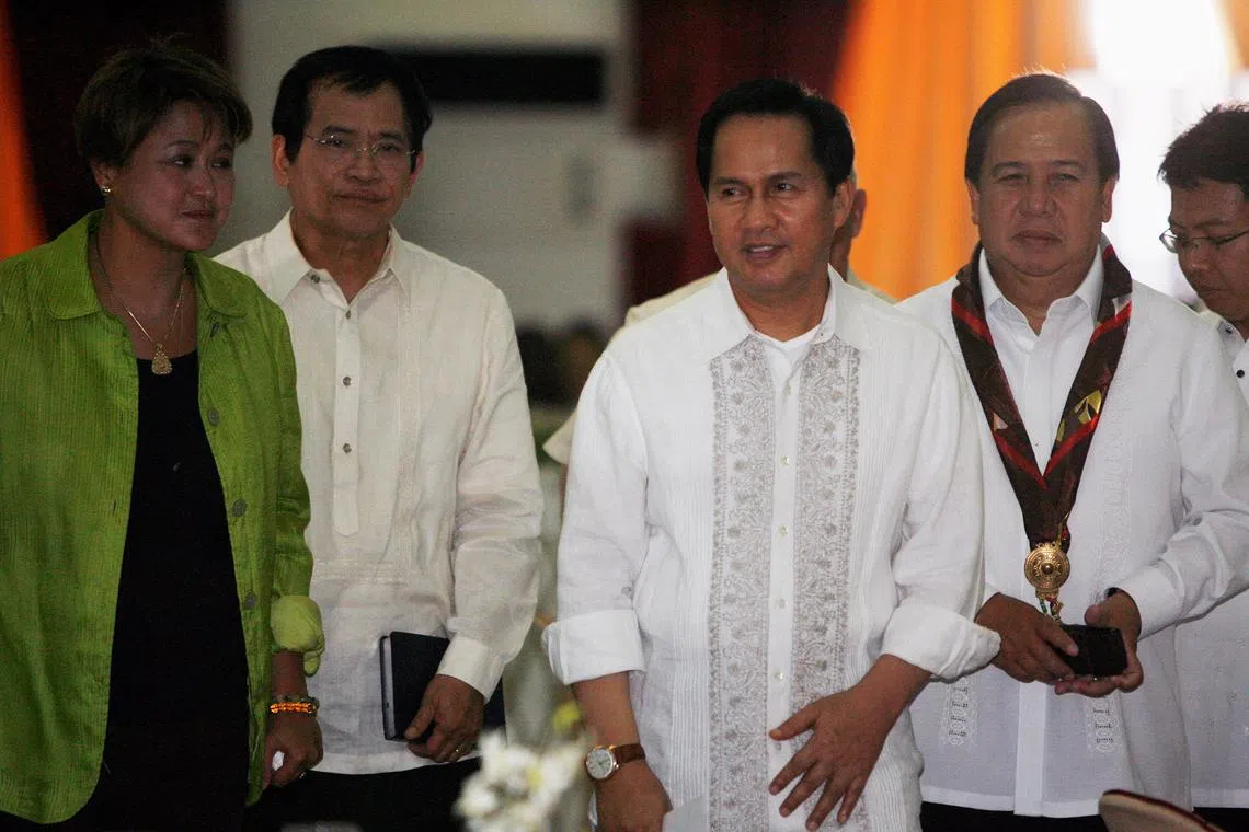 FILE PHOTO: International evangelist Pastor Apollo Quiboloy (2nd R) walks with presidential candidates attending his 60th birthday celebration in Davao City, southern Philippines April 25, 2010. REUTERS/Romeo Ranoco/File Photo