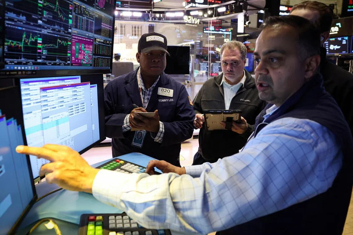 Traders working on the floor of the New York Stock Exchange, in New York City, on March 5.   