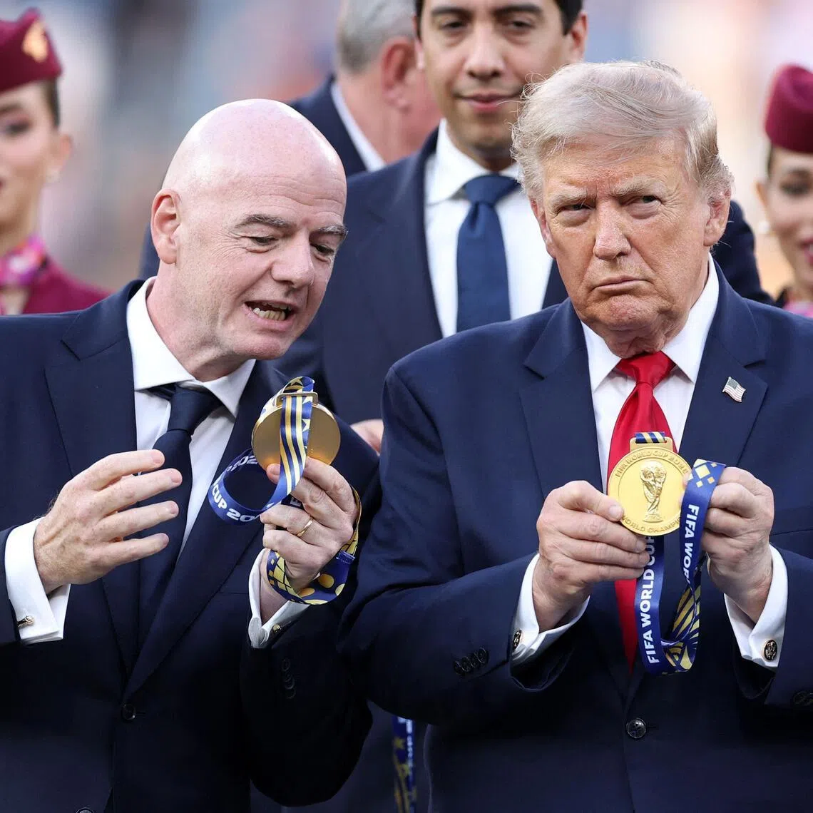 EAST RUTHERFORD, NEW JERSEY - JULY 19: FIFA President Gianni Infantino and U.S. President Donald Trump watch the medal at the award ceremony following the FIFA World Cup 2026 Final match between Spain and Argentina at New York New Jersey Stadium on July 19, 2026 in East Rutherford, New Jersey.   Justin Setterfield/Getty Images/AFP (Photo by Justin Setterfield / GETTY IMAGES NORTH AMERICA / Getty Images via AFP)
