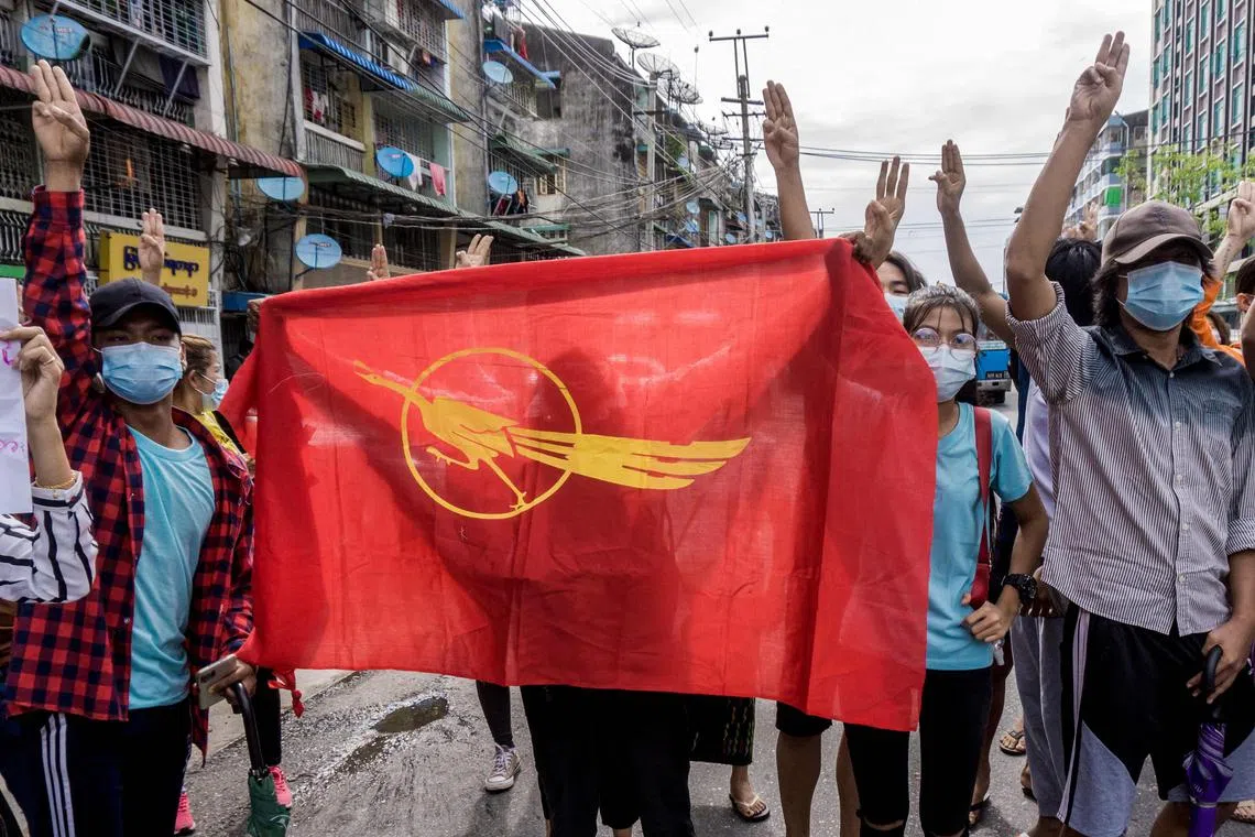 Protesters with the Myanmar Student Union flag demonstrating in Yangon on June 13, 2021.