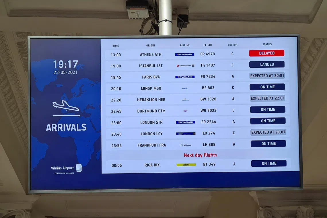 An information board showing international arrivals is pictured at Vilnius Airport, in Vilnius, Lithuania May 23, 2021. REUTERS/Andrius Sytas