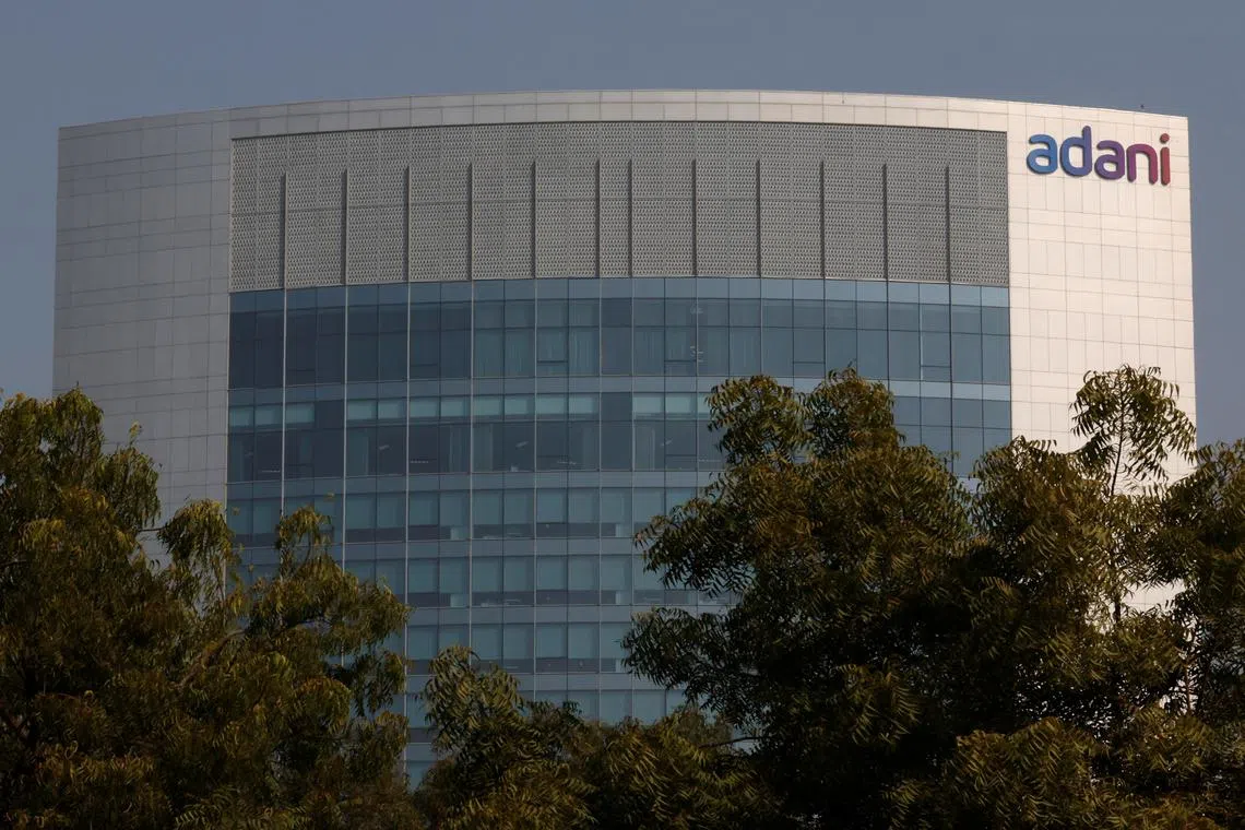 The logo of the Adani Group is seen on the facade of its Corporate House on the outskirts of Ahmedabad, India, November 22, 2024. REUTERS/Amit Dave/File Photo