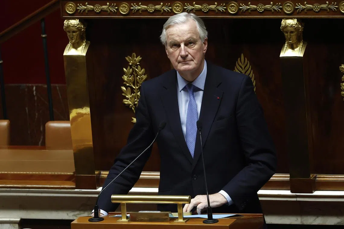 Far-right and left-wing lawmakers joined forces to back a no-confidence motion against French Prime Minister Michel Barnier and his government.
