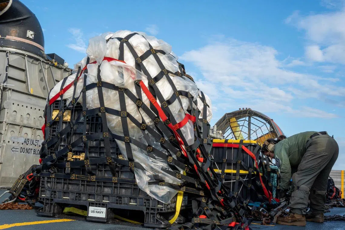 Sailors assigned to Assault Craft Unit 4 prepare material recovered in the Atlantic Ocean from a high-altitude Chinese balloon shot down by the U.S. Air Force off the coast of South Carolina for transport to federal agents at Joint Expeditionary Base Little Creek on February 10, 2023 in this image released by the U.S. Navy in Washington, U.S. February 13, 2023.  Mass Communication Specialist 1st Class Ryan Seelbach/U.S. Navy/Handout via Reuters THIS IMAGE HAS BEEN SUPPLIED BY A THIRD PARTY.