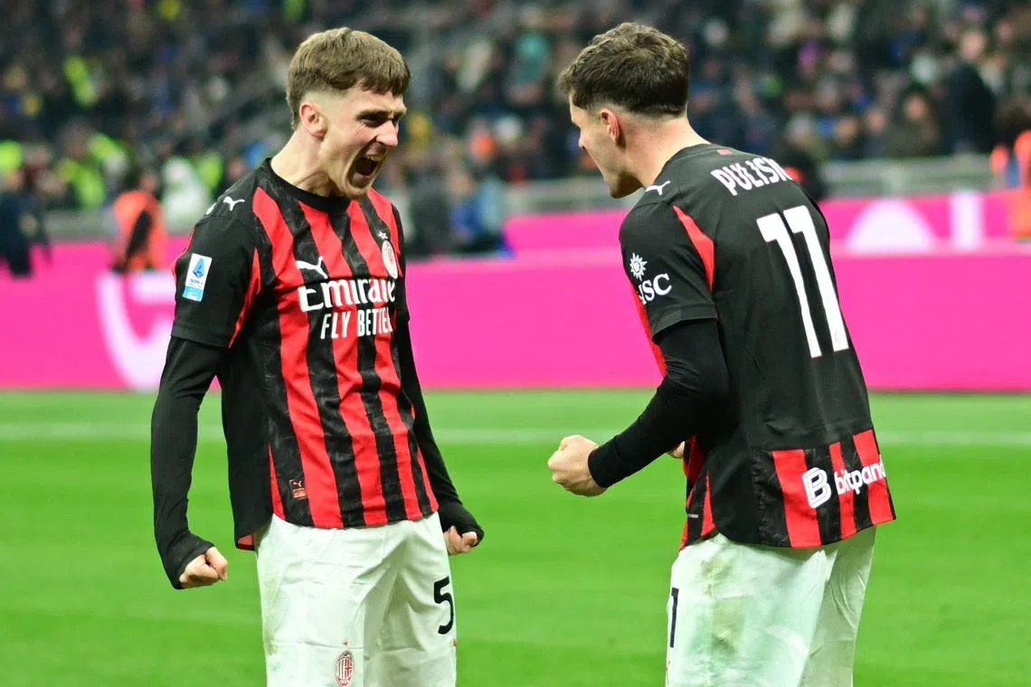 Soccer Football - Serie A - Inter Milan v AC Milan - San Siro, Milan, Italy - November 23, 2025 AC Milan's Christian Pulisic celebrates scoring their first goal with Alexis Saelemaekers REUTERS/Daniele Mascolo