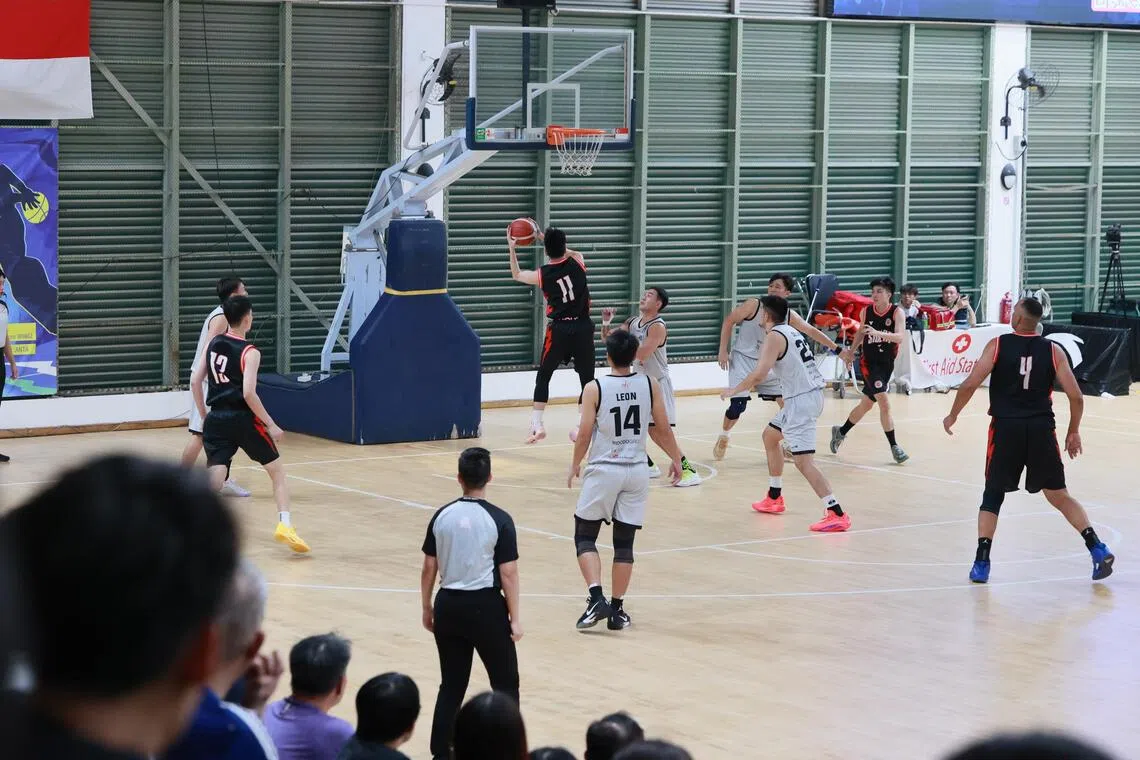 Adroit (in white) playing Siglap in their semi-final clash. Adroit won 67-52. 