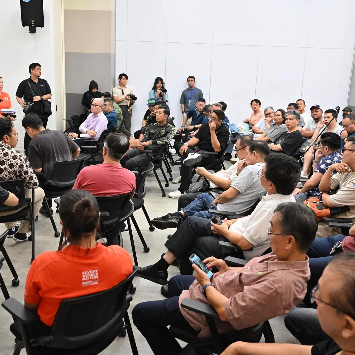 NTUC Secretary-General Ng Chee Meng (far left) taking questions during a dialogue session with platform workers on Aug 26, 2026.