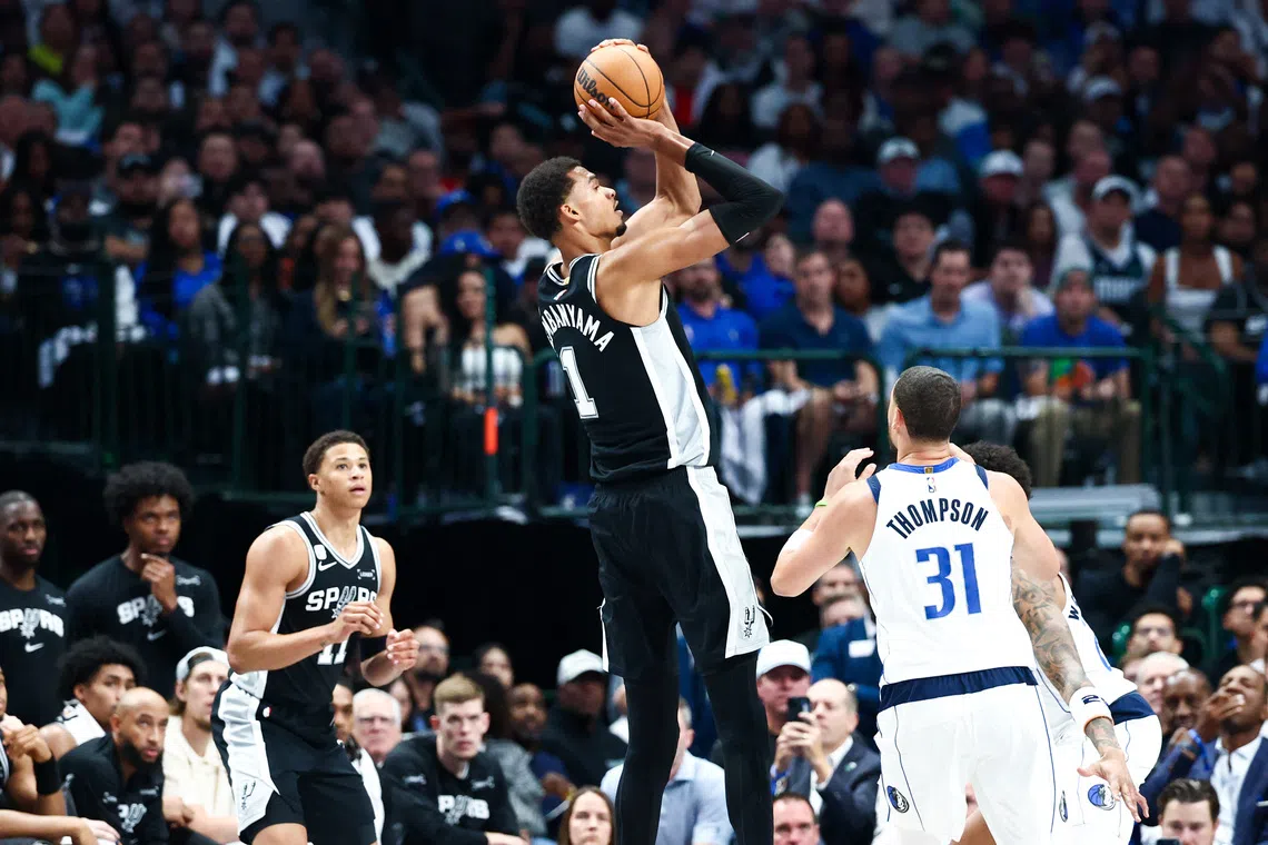 Oct 22, 2025; Dallas, Texas, USA;   San Antonio Spurs forward Victor Wembanyama (1) shoots over Dallas Mavericks guard Klay Thompson (31) during the first half  at American Airlines Center. Mandatory Credit: Kevin Jairaj-Imagn Images