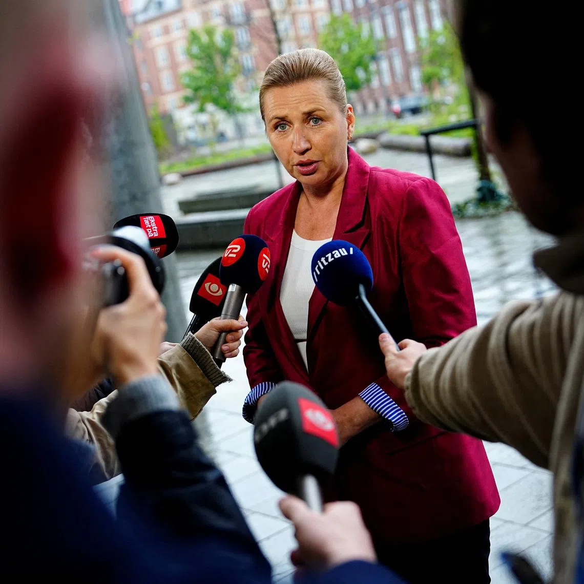 Acting Danish Prime Minister Mette Frederiksen speaks to the media as she arrives for a meeting with appointed royal investigator Troels Lund Poulsen on negotiations to form a government, in Copenhagen, Denmark, May 11, 2026. Ritzau Scanpix/Mads Claus Rasmussen via REUTERS