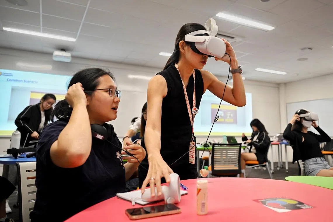 Associate Professor May Lim, Assistant Provost (Applied Learning) at SIT, trying out the Experience Dementia in Singapore (Edis) VR simulation.