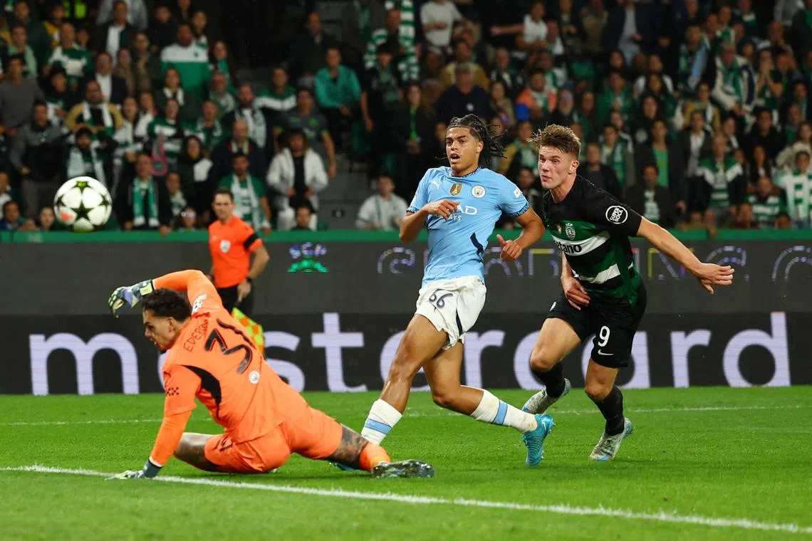 Sporting Lisbon's Viktor Gyokeres scores their first goal past Manchester City's Ederson.   