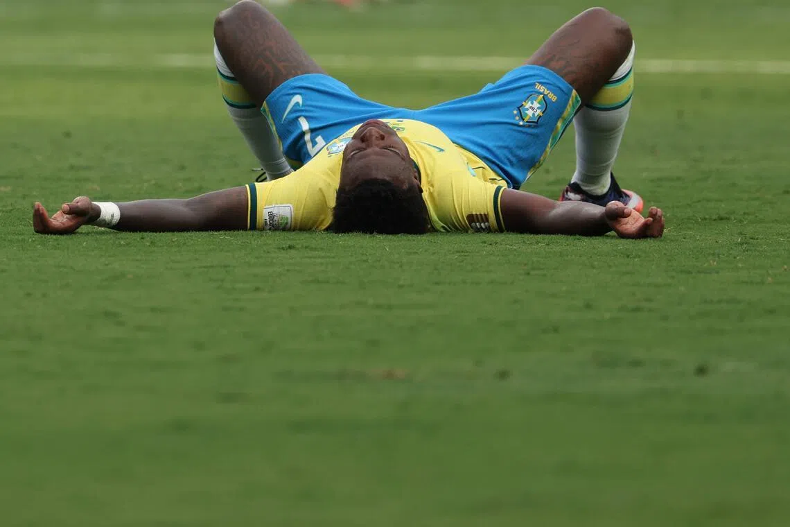 (FILES) Brazil's forward #07 Vinicius Junior reacts after losing the 2026 World Cup round of 16 football match between Brazil and Norway at the New York/New Jersey Stadium in East Rutherford on July 5, 2026. Vinicius Junior apologized to Brazilian fans on July 10, 2026 for the "enormous frustration" caused by their World Cup elimination by Norway and promised to "fight" to restore the might of the Selecao. (Photo by Odd ANDERSEN / AFP)