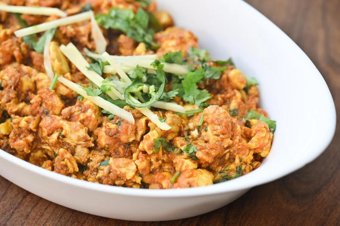 Brain masala made up of goat brain stir fried with tomatoes, browned onions, spices and green chillies costs $20, at Bar B Q Tonight restaurant on Sept 3, 2026. 

(ST PHOTO: LIM YAOHUI)